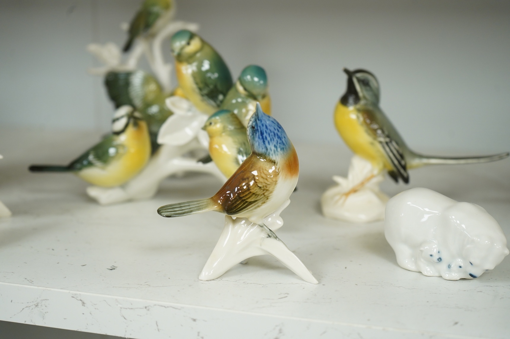 A collection of Copenhagen and other German porcelain birds, tallest 20cm